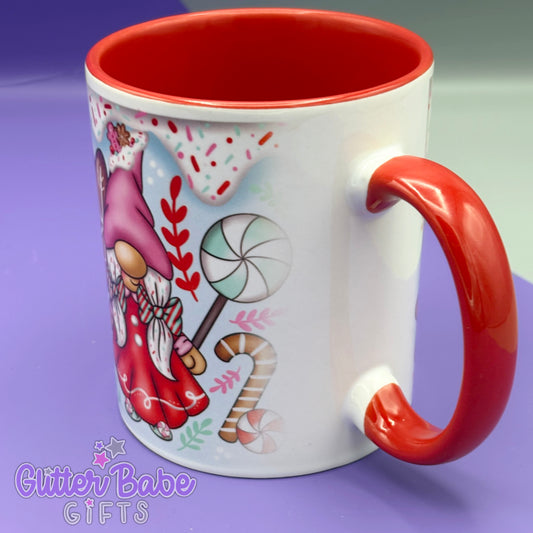 image is showing a close up of a blurred print near handles on a mug with candycane lane design.