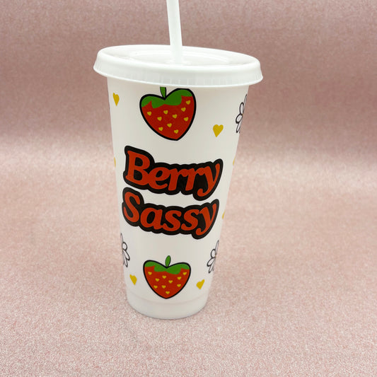 Tumbler with 'Berry Sassy' text and strawberry graphics on a pink background
