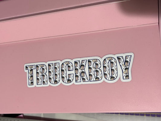 Pink machine with 'TRUCKBOY' sticker on it featuring a pattern of logos