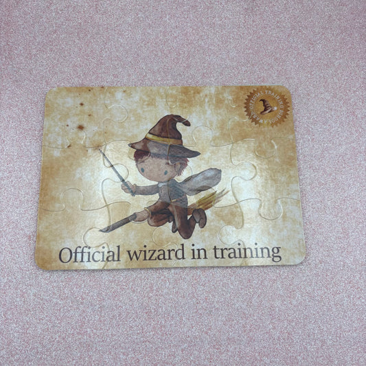 Jigsaw puzzle with a flying wizard design on a textured surface