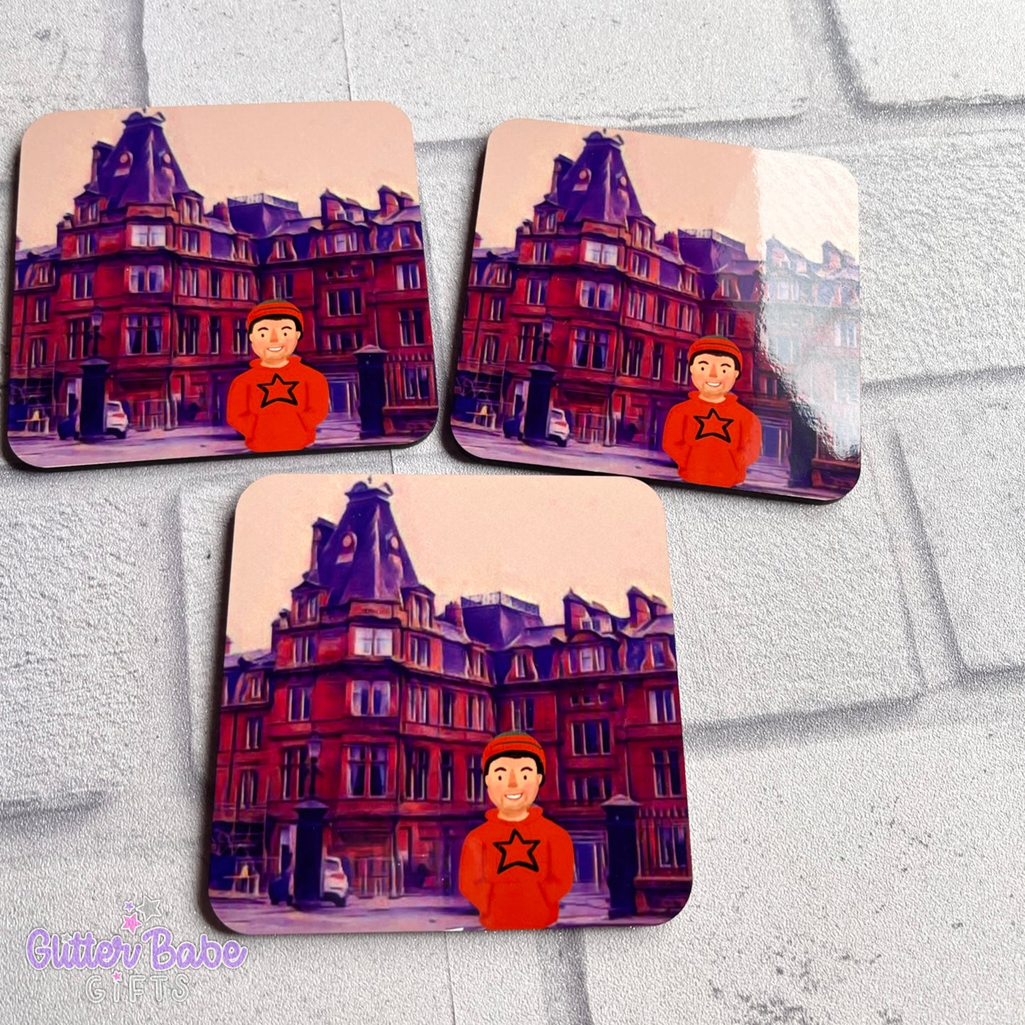 three coasters showing ayr station hotel and stu avatar on white background