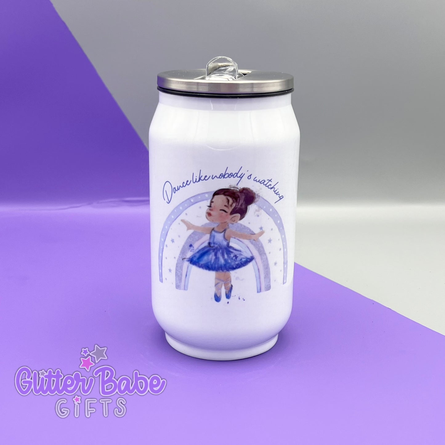 A white can shaped bottle with aluminium lid against a a grey and purple backdrop, Can has a brunette ballerina wearing lilac in front of a rainbow rainbow image with curved text  above her printed onto it.