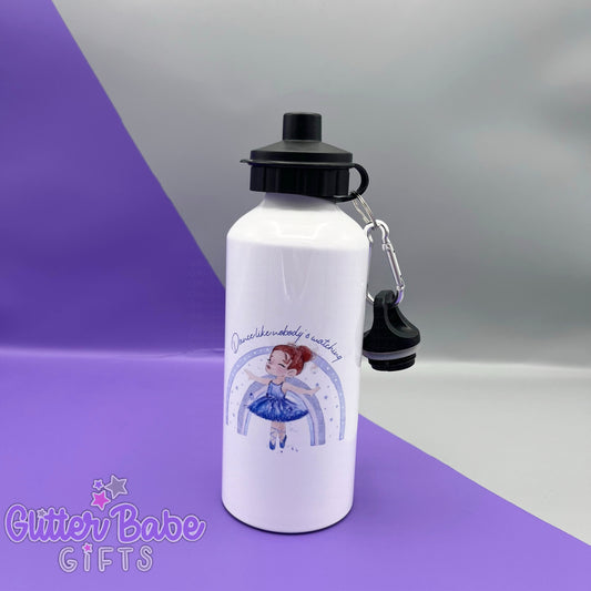 a white drinks bottle with two black lids against a purple and grey backdrop. Bottle has a redhaired ballerina wearing lilac stood in front of a rainbow and some text above image printed on to the front. 