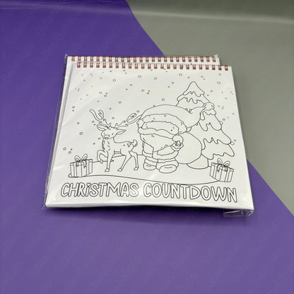 Colouring book with Christmas-themed design and 'Christmas Countdown' text on a purple surface.