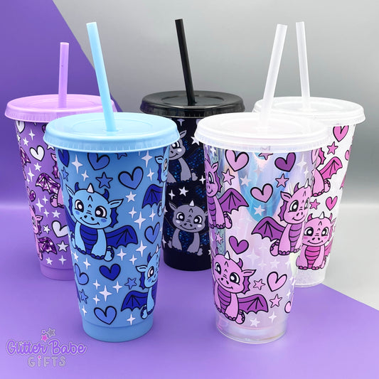 a selection of various coloured tumblers with dragon design in variety of colours on a purple and grey backdrop