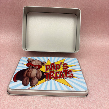 Tin box with a cartoon bear and 'Dad's Treats' text on a pink background