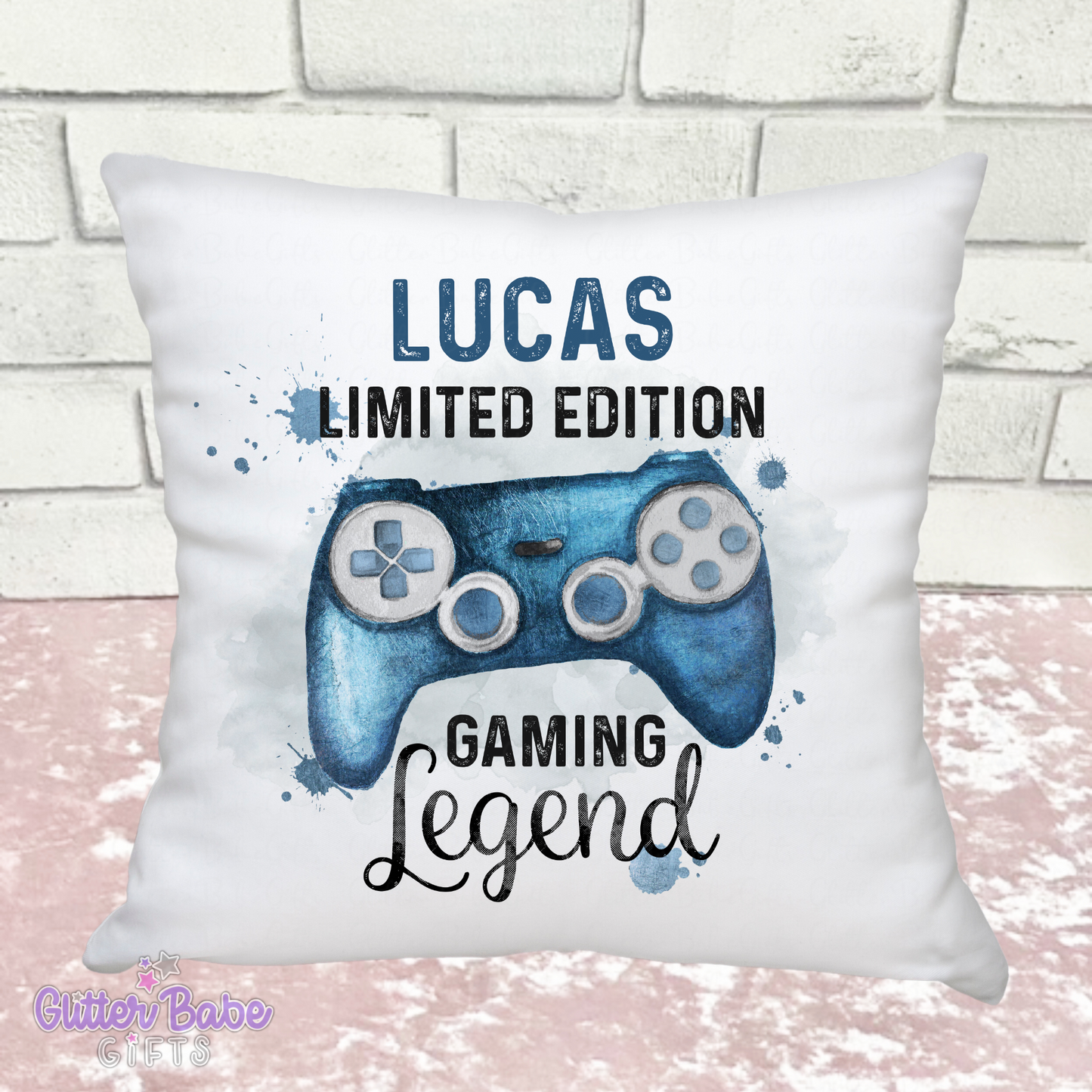 white cushion showing a gaming controller image in blue saying "Lucas limited edition gaming legend" 