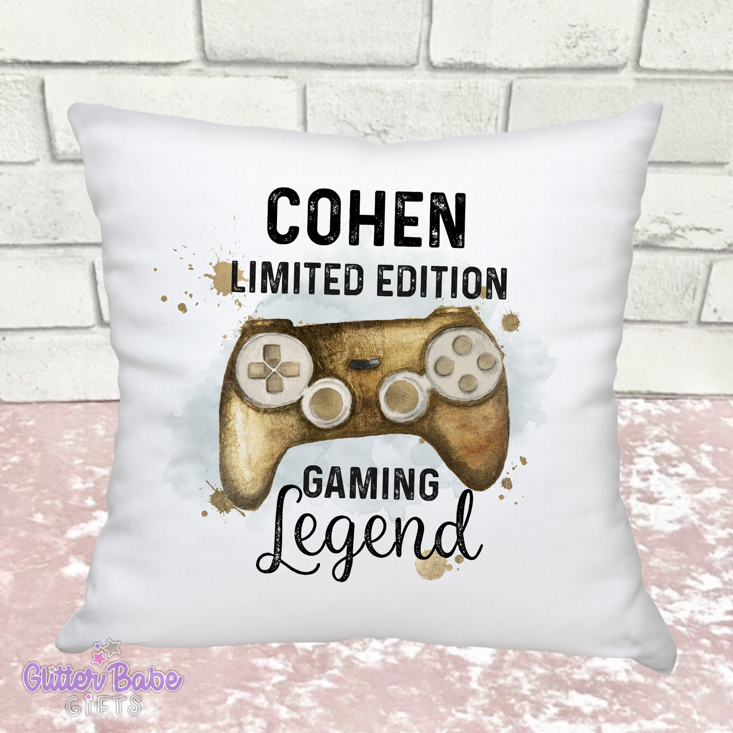 white cushion showing a gaming controller image in Gold saying "Cohen limited edition gaming legend"