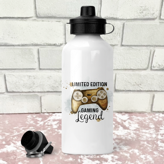 White water bottle with a gold gaming-themed design on a white brick background
