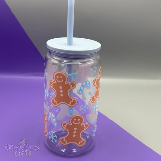 Tumbler with gingerbread man design on a purple and gray background