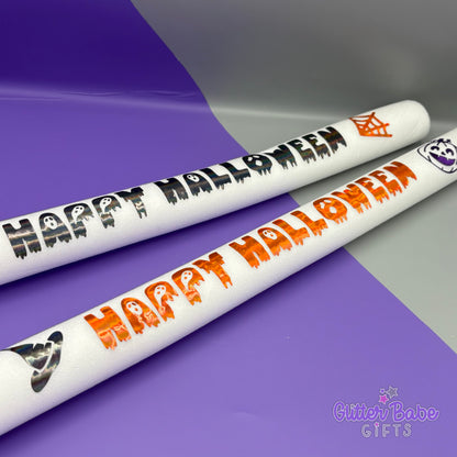 Two Halloween-themed sticks with 'Happy Halloween' text on a purple and gray background, featuring the brand 'Glitter Babe Gifts'.