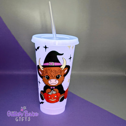 Tumbler with a cow wearing a witch hat and pumpkin design on a purple and gray background, featuring the brand 'Glitter Babe Gifts'.