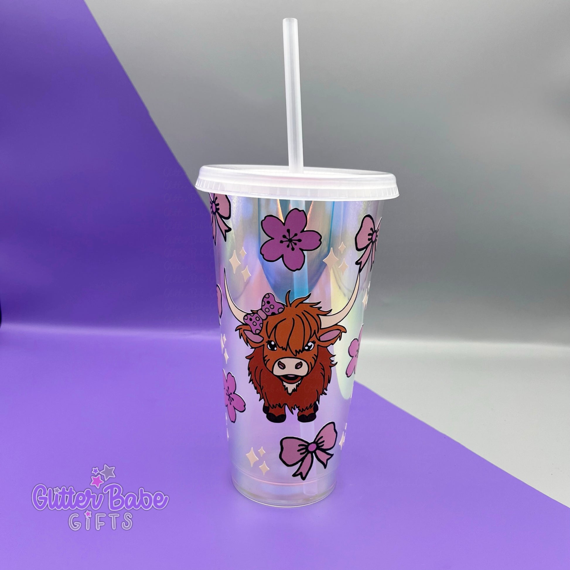 Opal coloured tumbler with highland cow flowers and bows against a purple and grey background