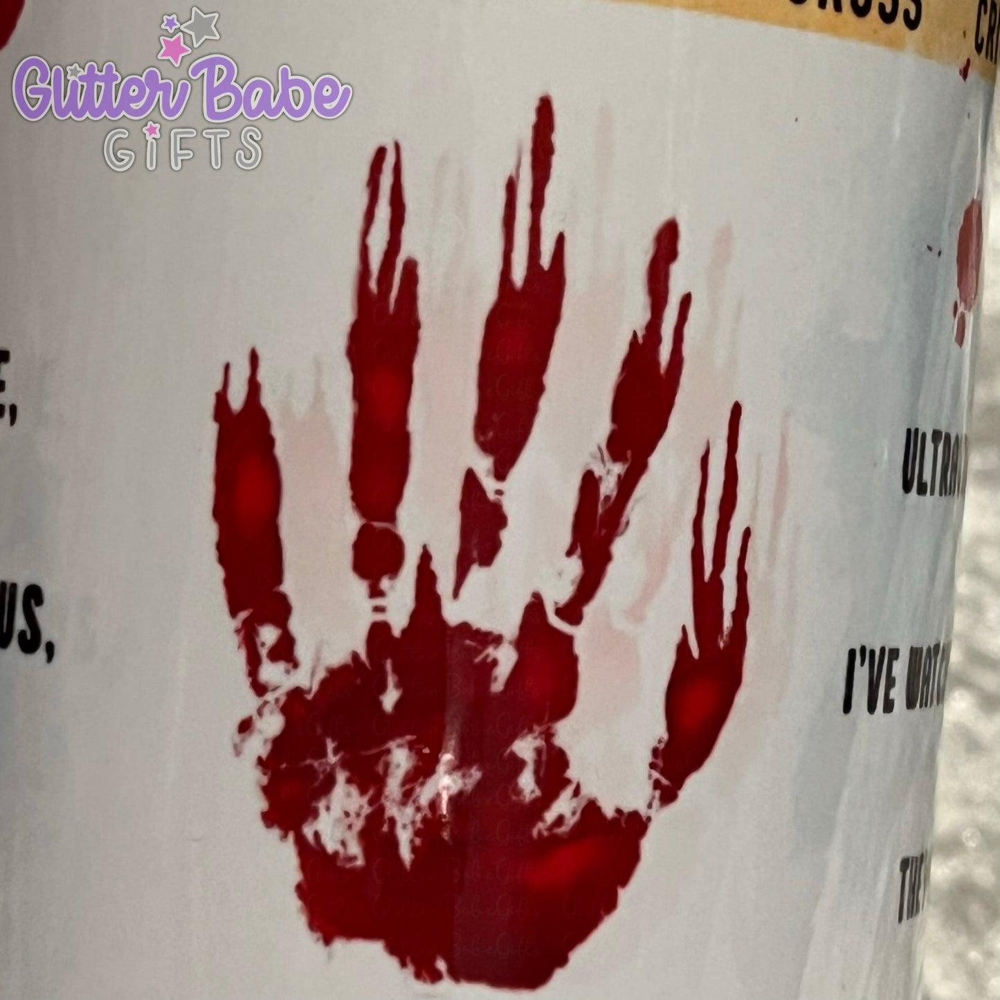 close up image showing a slightly blurry handprint on a mug