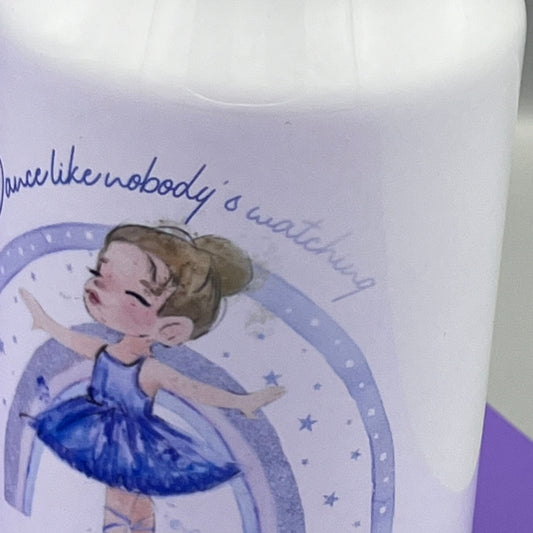 A Close up of a blurred wording showing above a ballerinas head