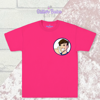 Pink t-shirt with cartoon logo on left chest laying on pink and white background