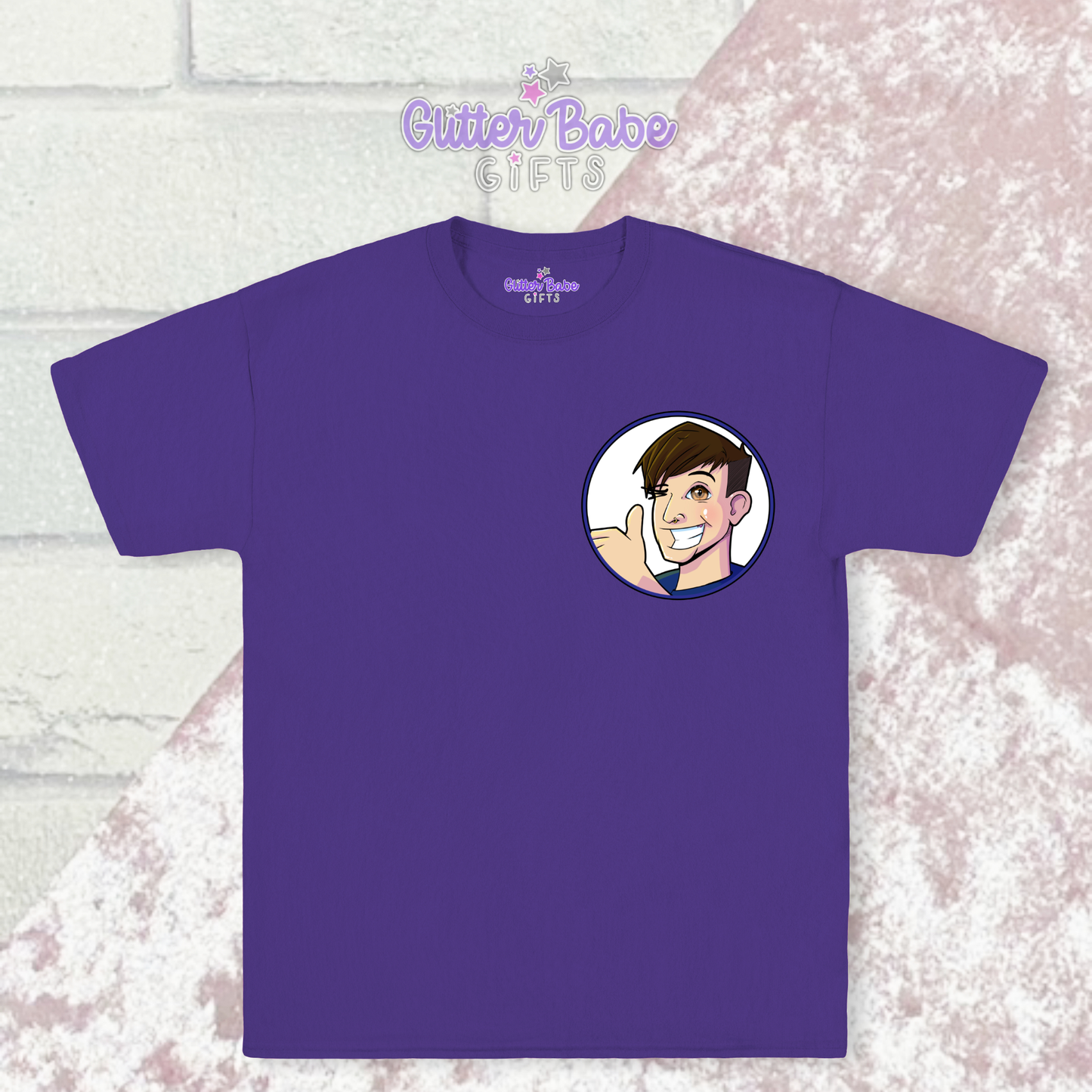 Purple t-shirt with cartoon logo on left chest laying on pink and white background