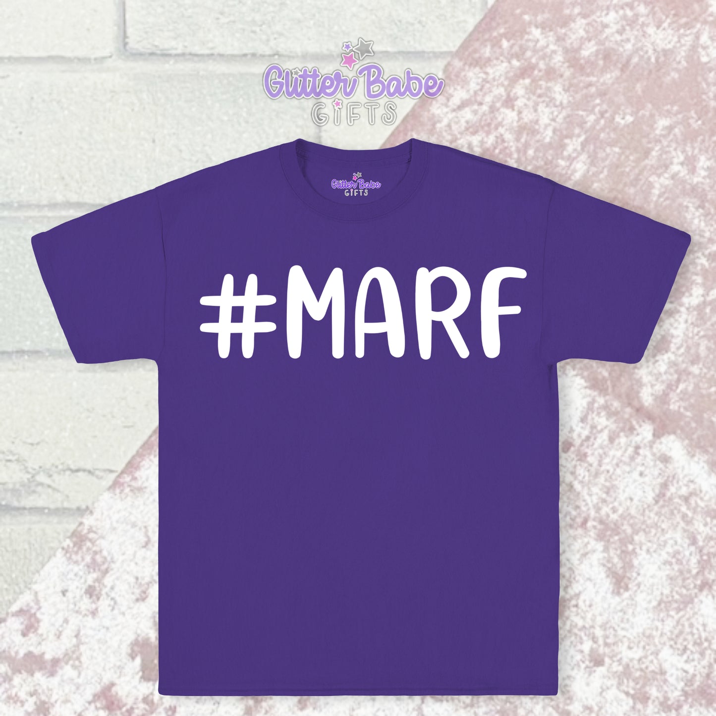  Purple T-shirt with white writing saying #marf with a pink and white backdrop