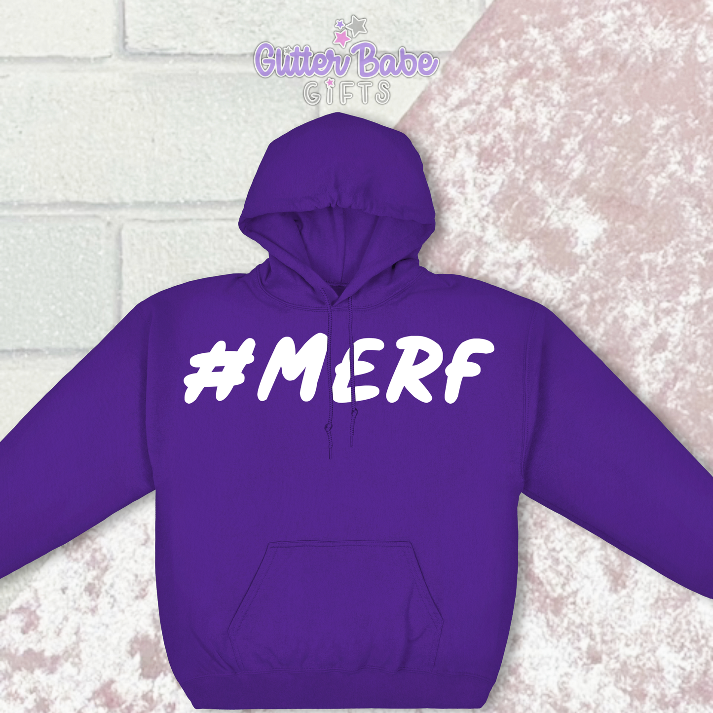 Purple Hoodie with the wording #Merf on against a pink and white backdrop