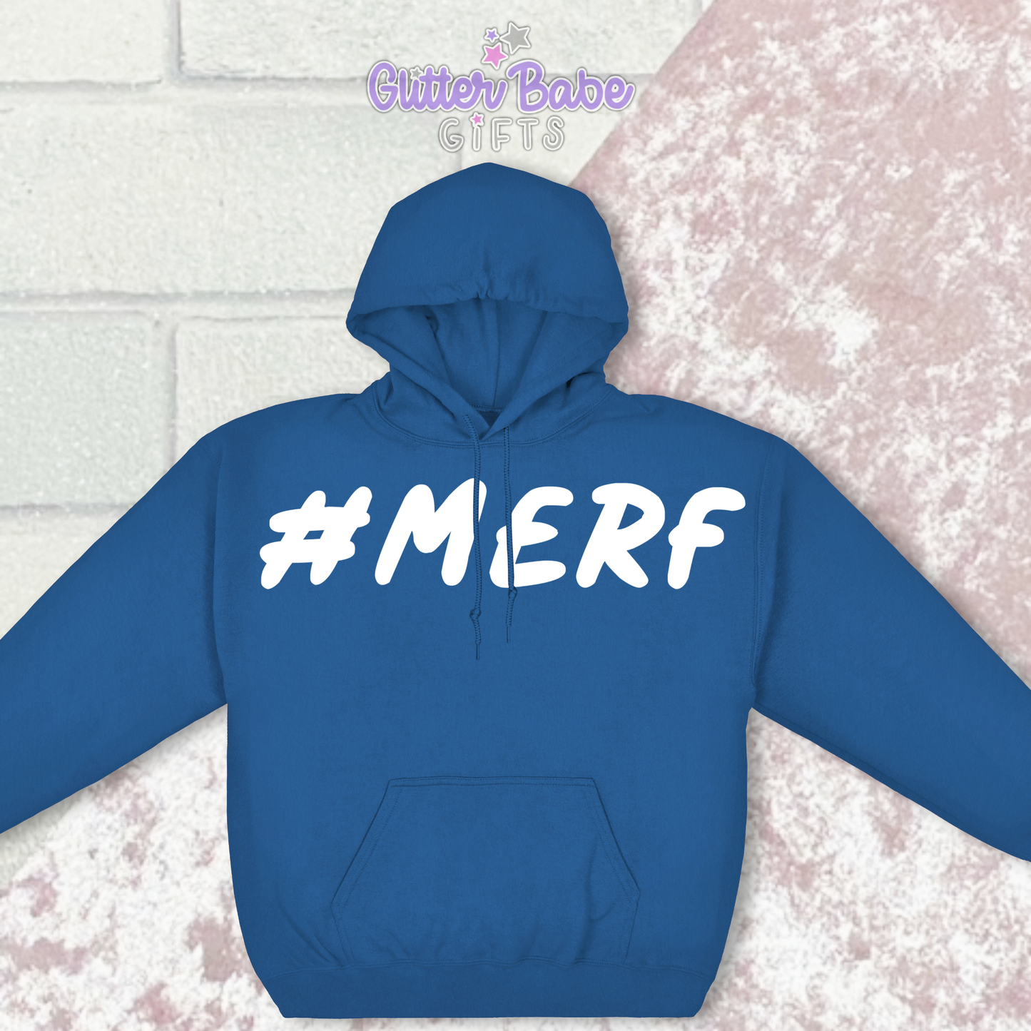 Blue Hoodie with the wording #Merf on against a pink and white backdrop