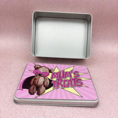 Metal storage tin with a pink lid featuring a teddy bear and 'Mum's Treats' text on a pink background.