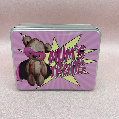 Tin box with a teddy bear illustration and 'Mum's Treats' text on a pink background