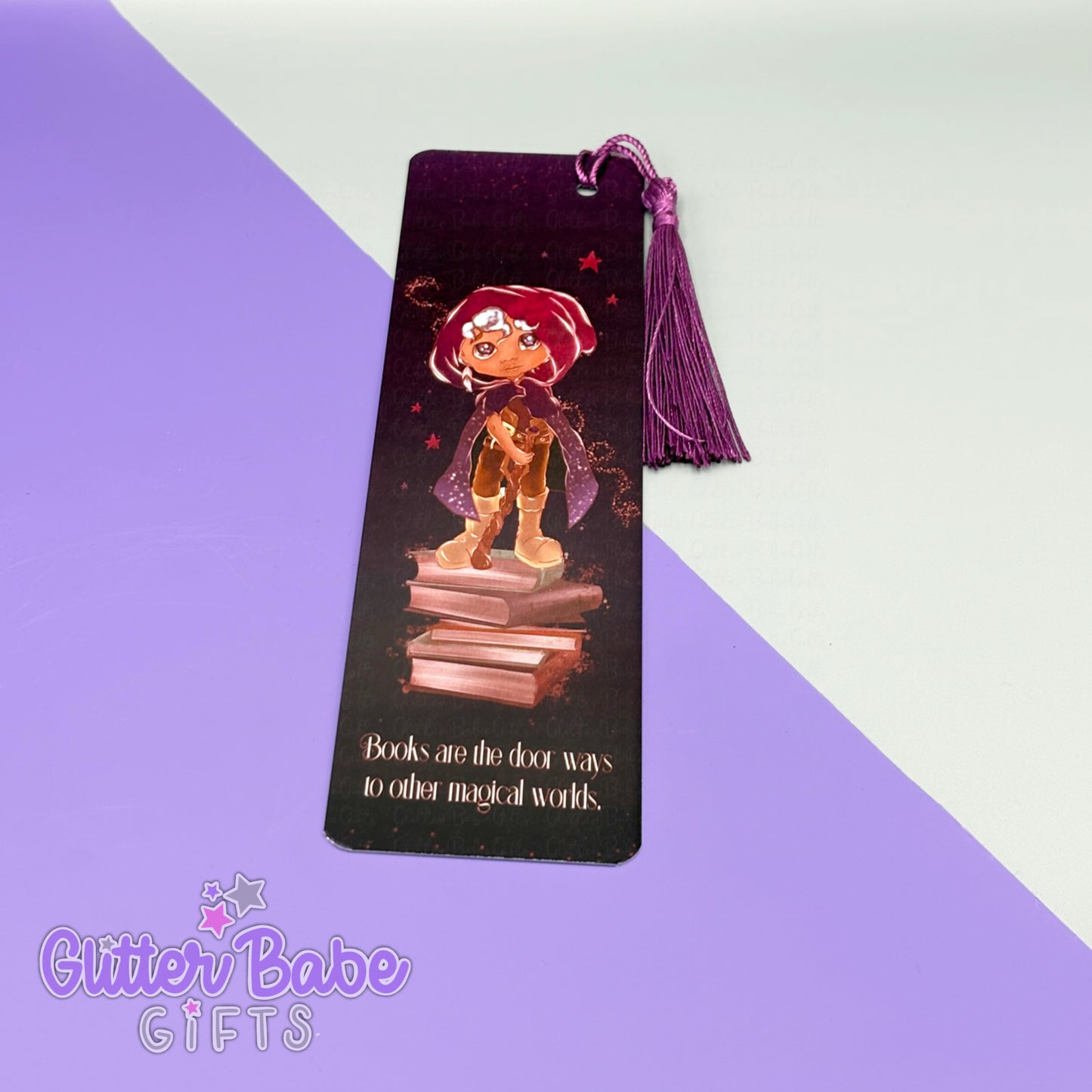 a wizard deign on a bookmark with wording "books are the door ways to other magical worlds" on it with a purple tassel. the bookmark lies on a purple and grey background