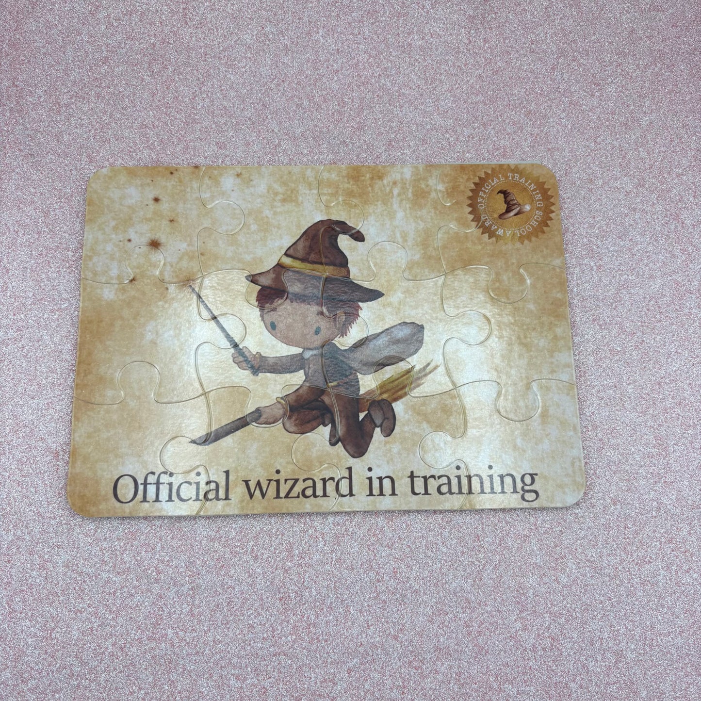 Jigsaw puzzle with a flying wizard design on a textured surface