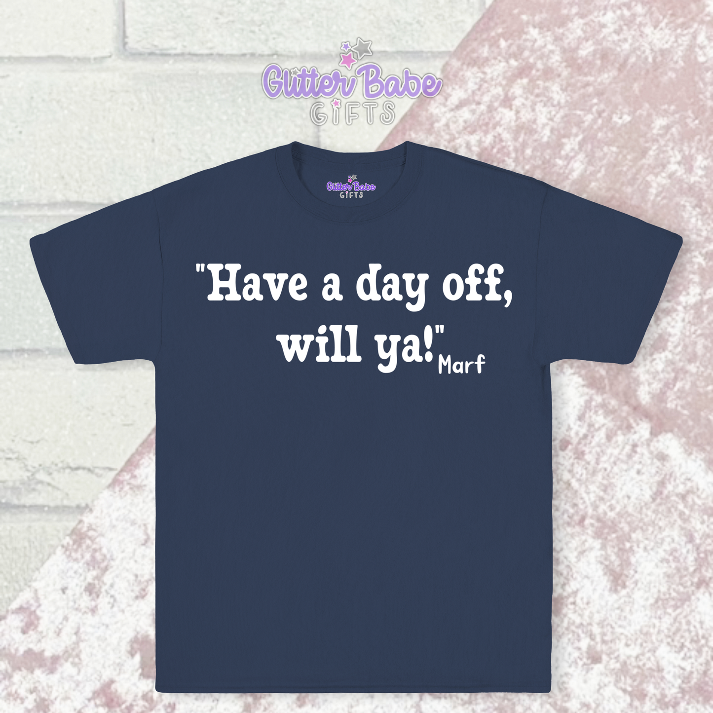 A Navy t-shirt with white writing on a pink and white background