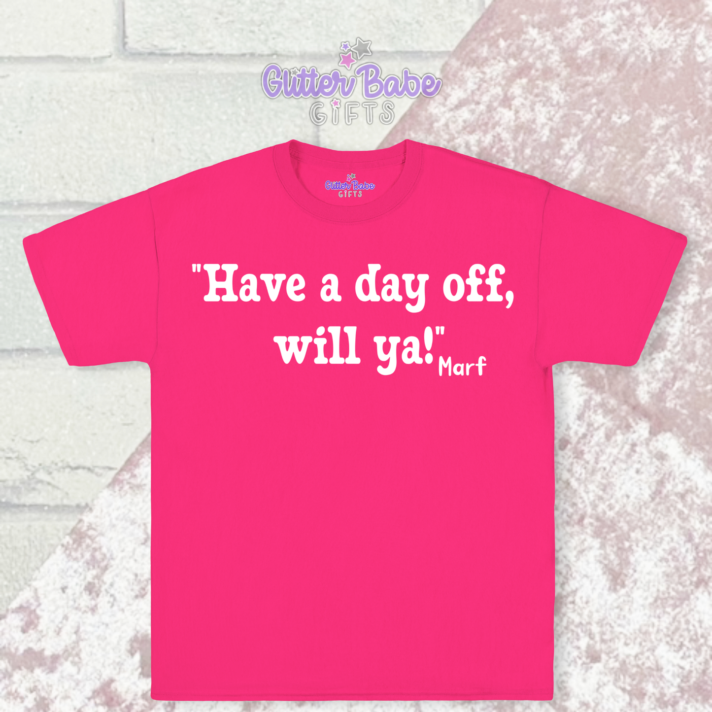 Pink t-shirt with white writing on a pink and white background