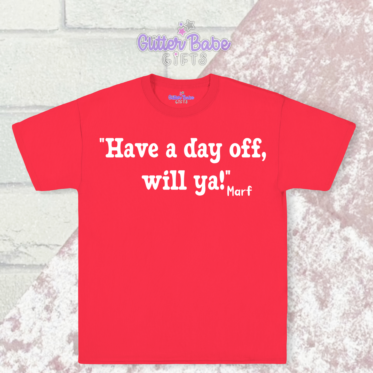 A red t-shirt with white writing on a pink and white background