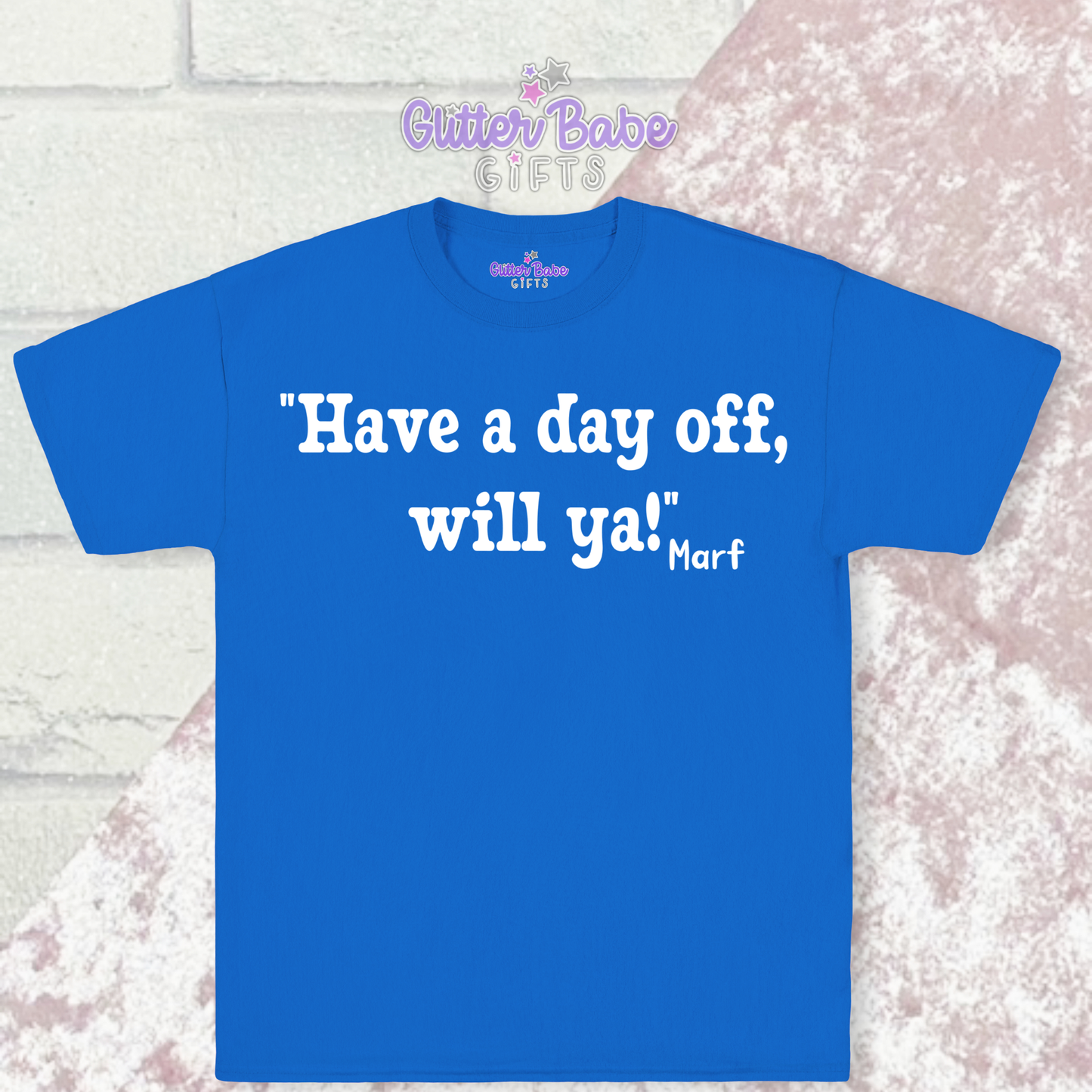 blue t-shirt with white writing on a pink and white background