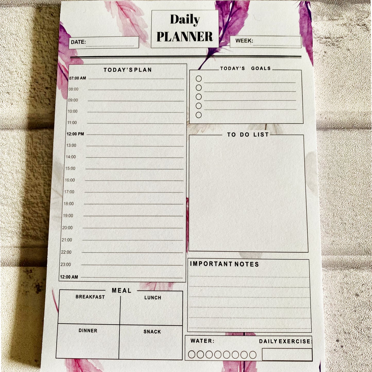 purple leaves pattern. daily planner sectioned for plans, goals, to do list , meals and important notes