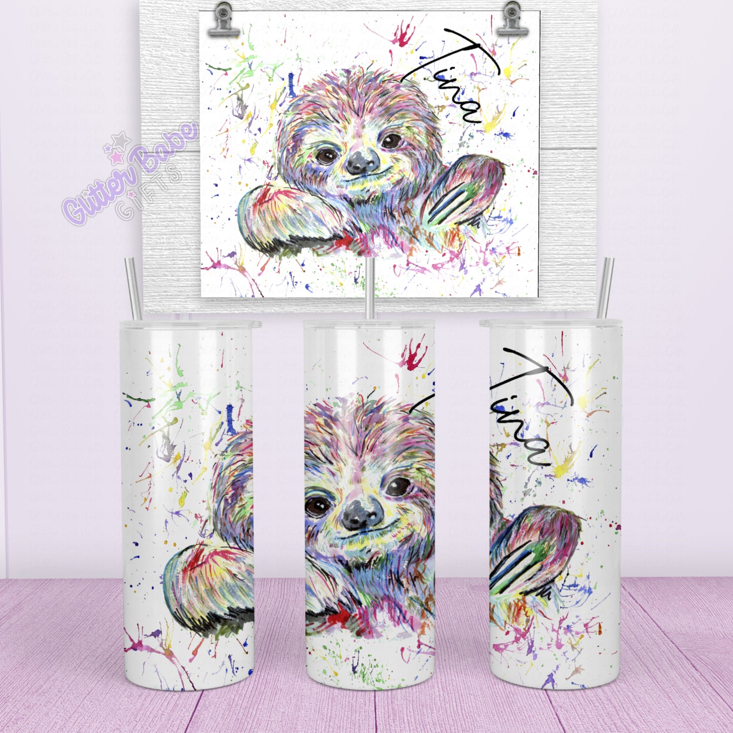 white tall skinny tumbler with a colourful rainbow sloth image and a water splash splatter effect background with a name in Black writing