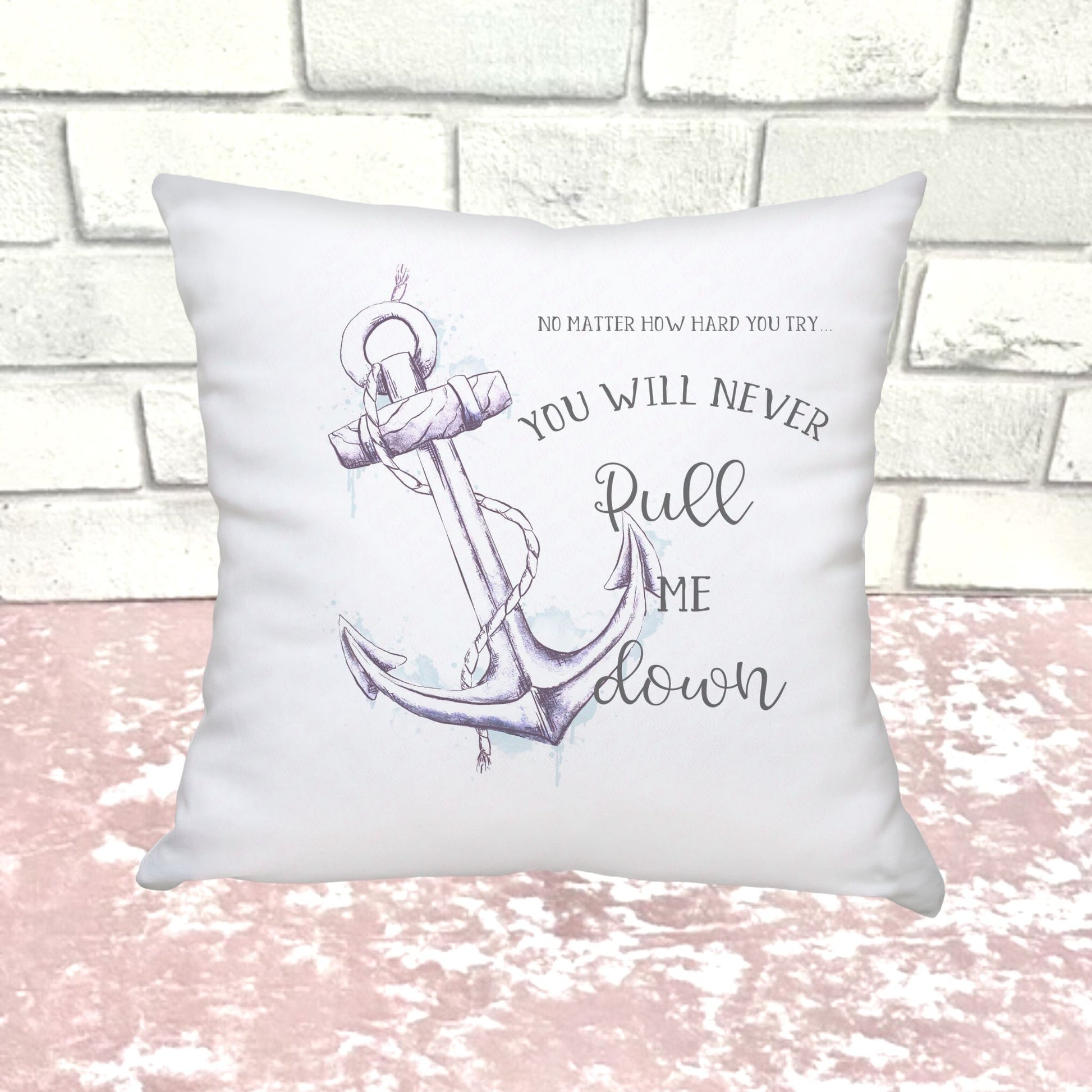 White cushion with a Lilac Anchor with rope and the words No matter how hard you try you will never pull me down