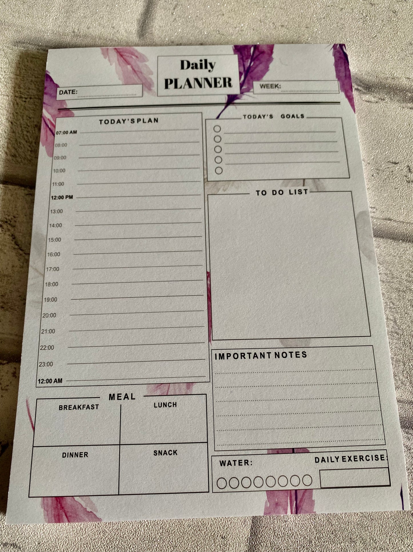 daily planner with leafy pattern and sections for to do list, meals, todays goals and plan